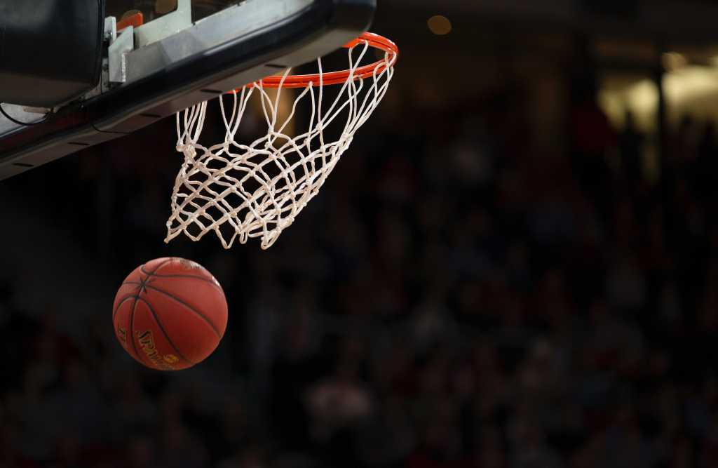 Basketball falling into a hoop