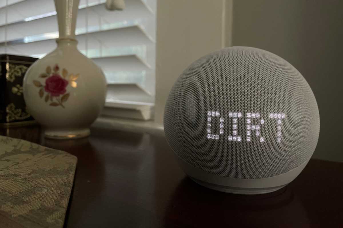 Amazon Echo Dot with Clock (5th Gen) showing song title