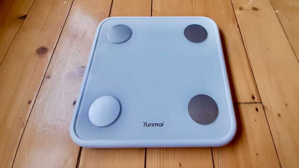 Yunmai 3 smart scale on floorboards